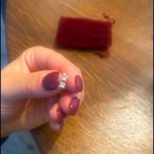 .25 carat diamond earrings between both, princess cut. Certified by jeweler.